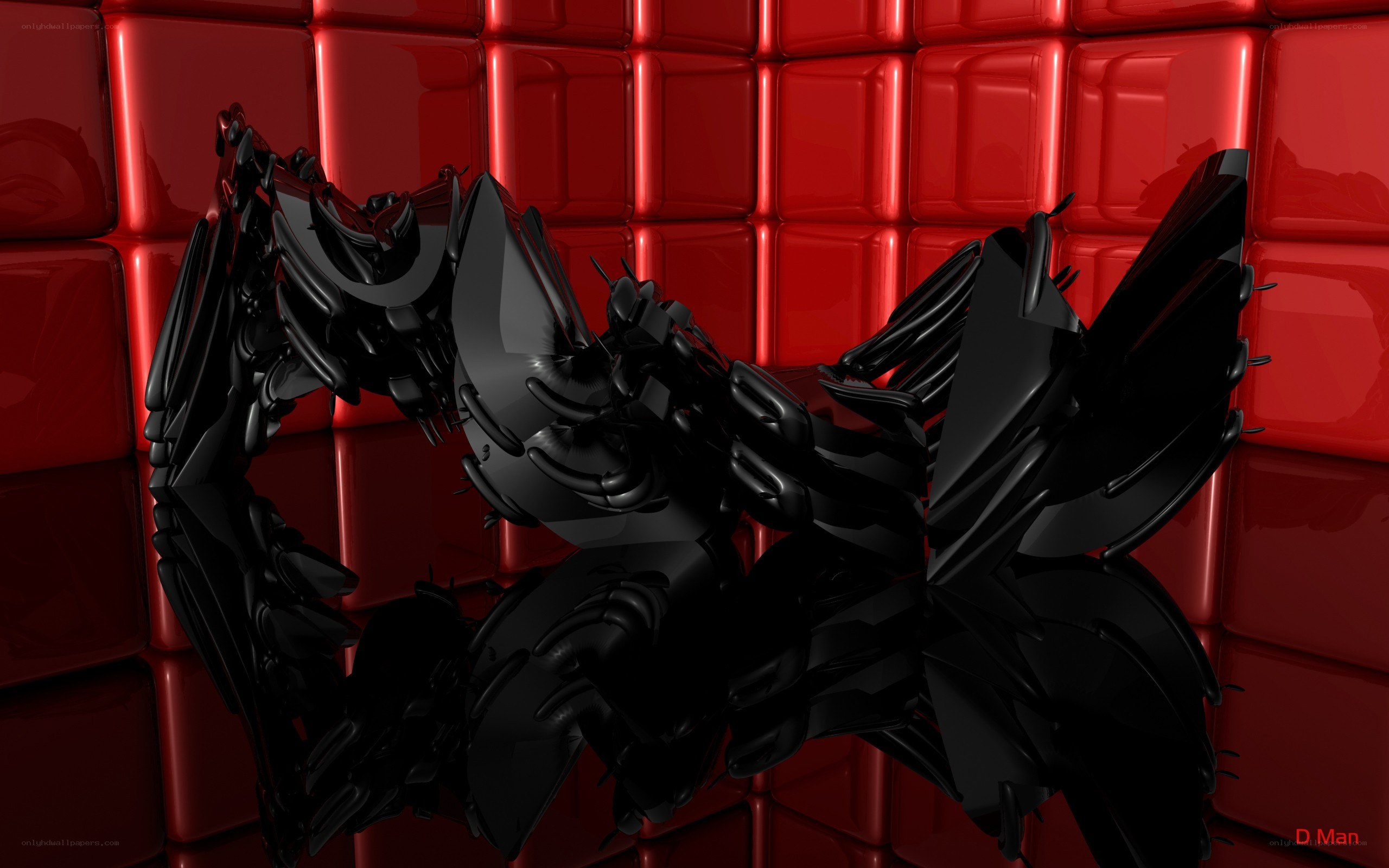 black abstract sculpture on red wall
