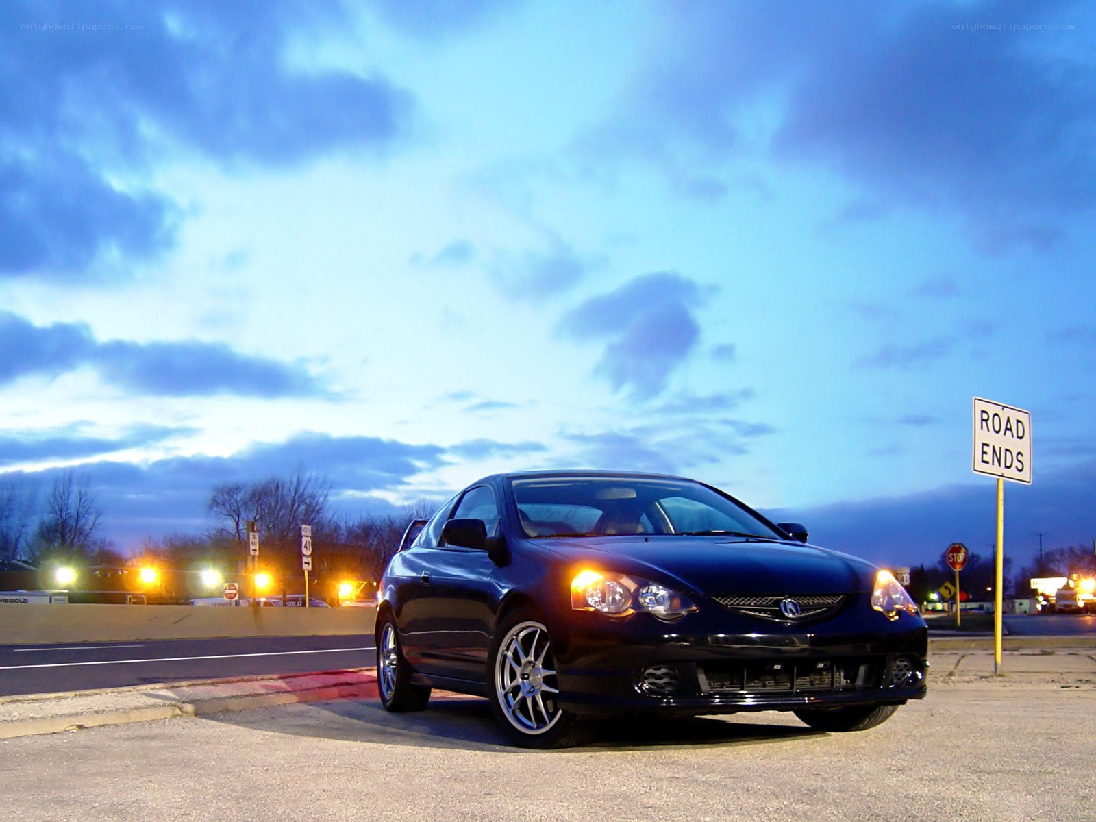 Black Acura Integra at dusk