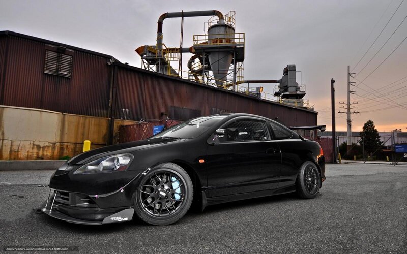 Black Acura Integra in industrial setting