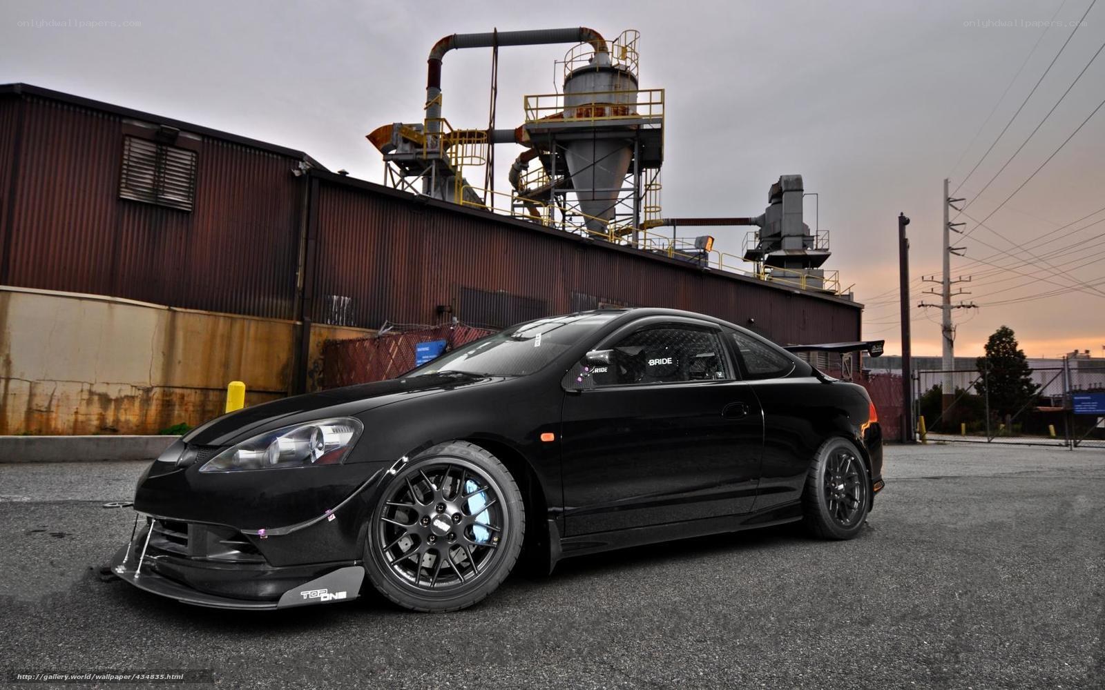 Black Acura Integra in industrial setting
