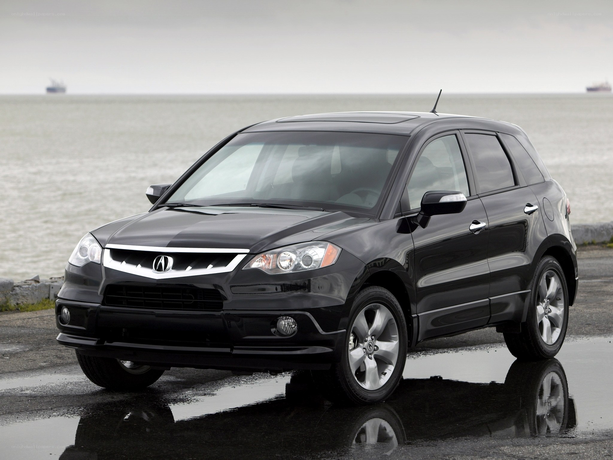 Black Acura RDX by the sea