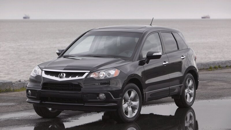 Black Acura RDX by the water