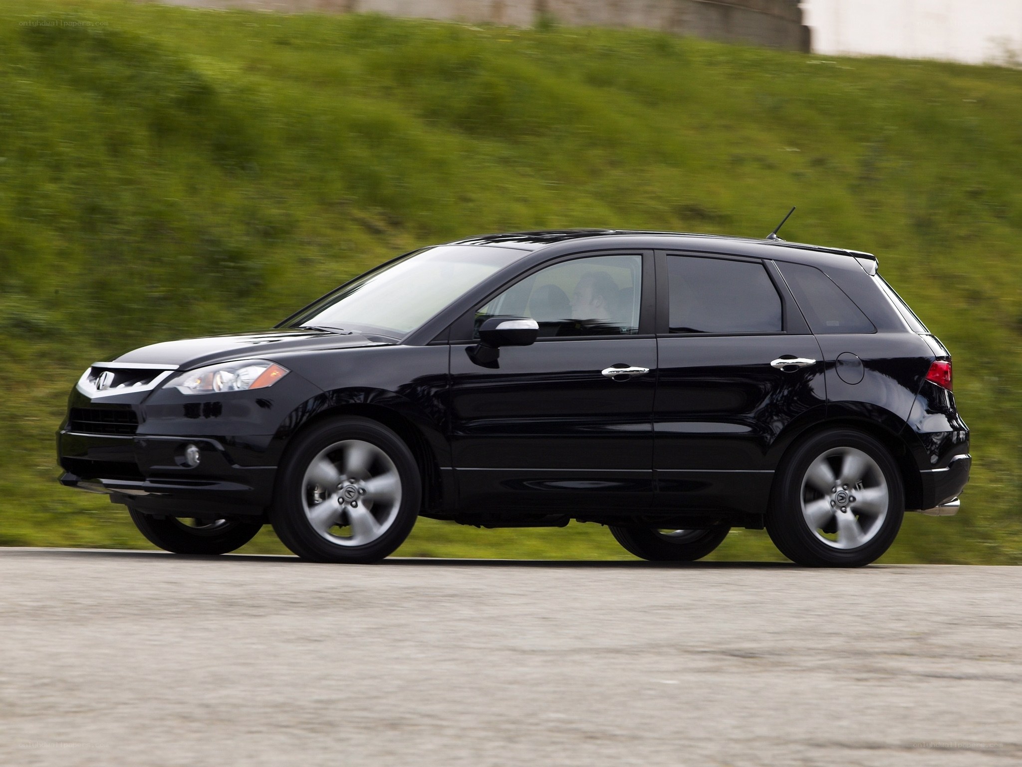 black acura rdx in motion