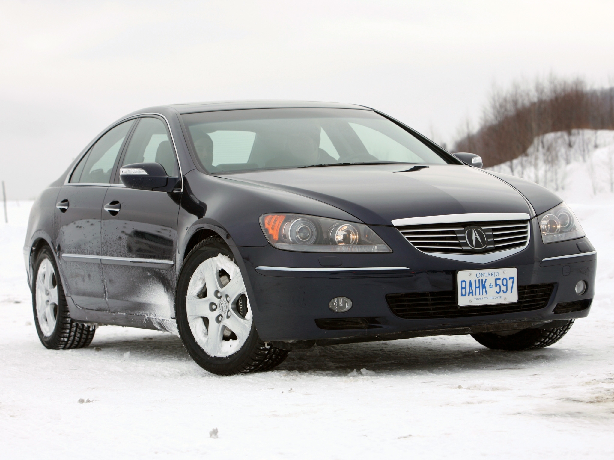 Black Acura RL in snow