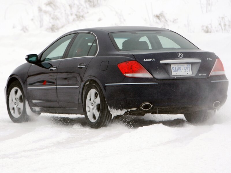 Black Acura RL in snow