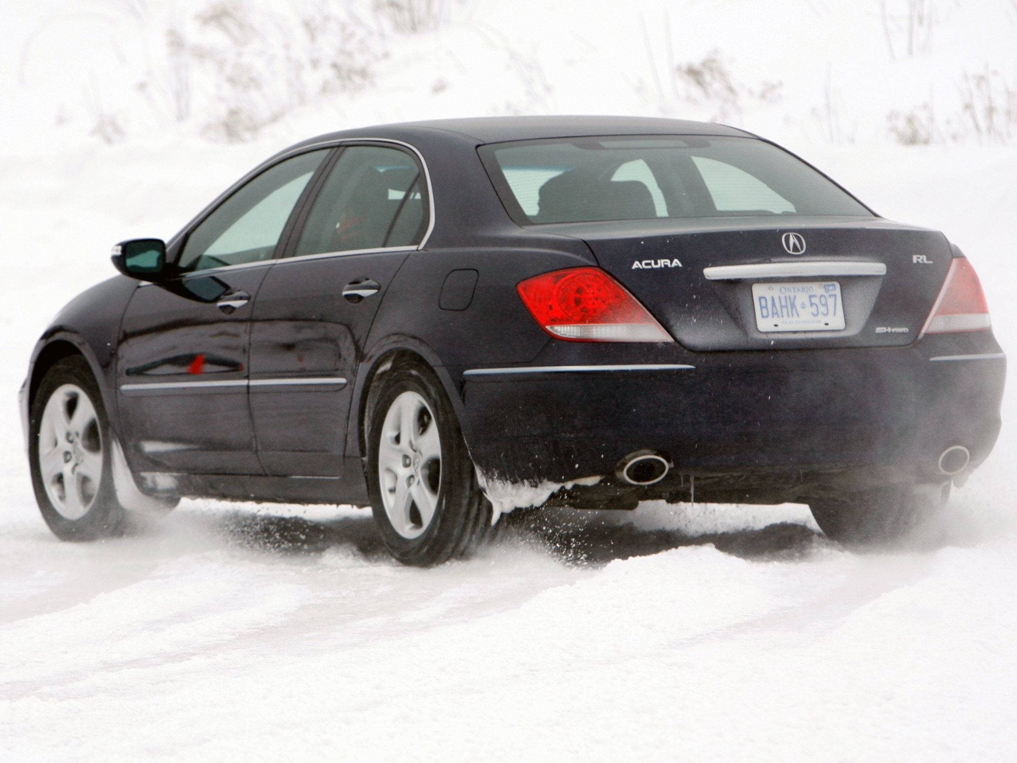 Black Acura RL in snow