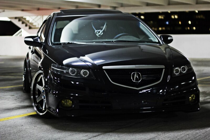 Black Acura TL in parking garage