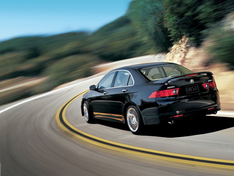 Black Acura TSX on winding road