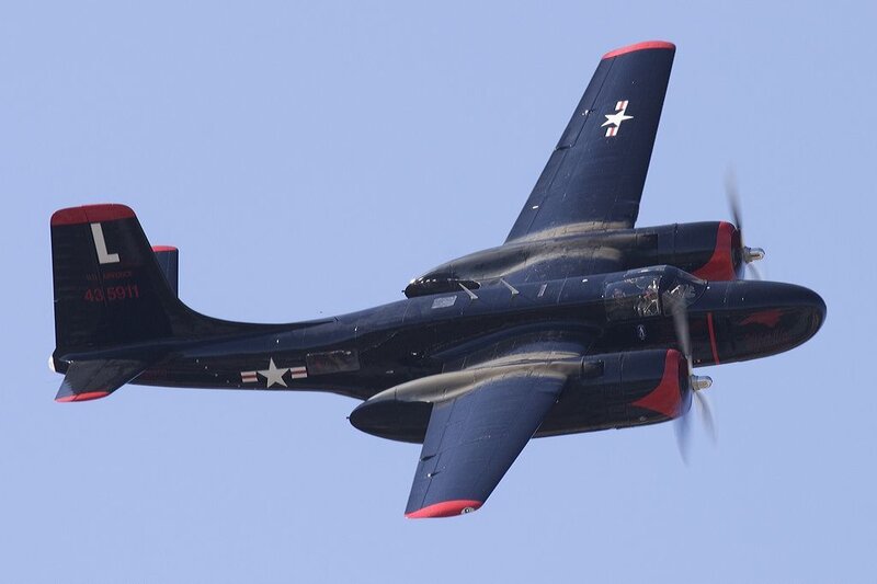 Black aircraft in flight