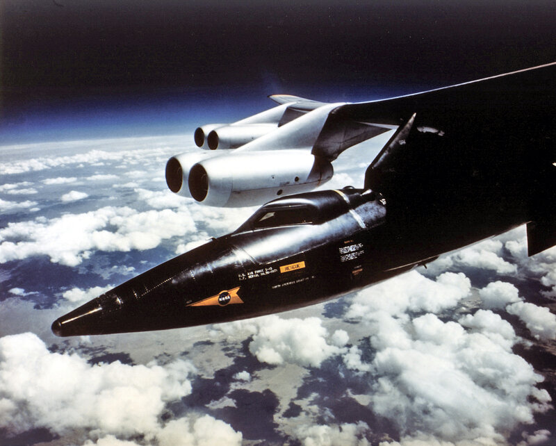 Black Aircraft in Flight — Dramatic