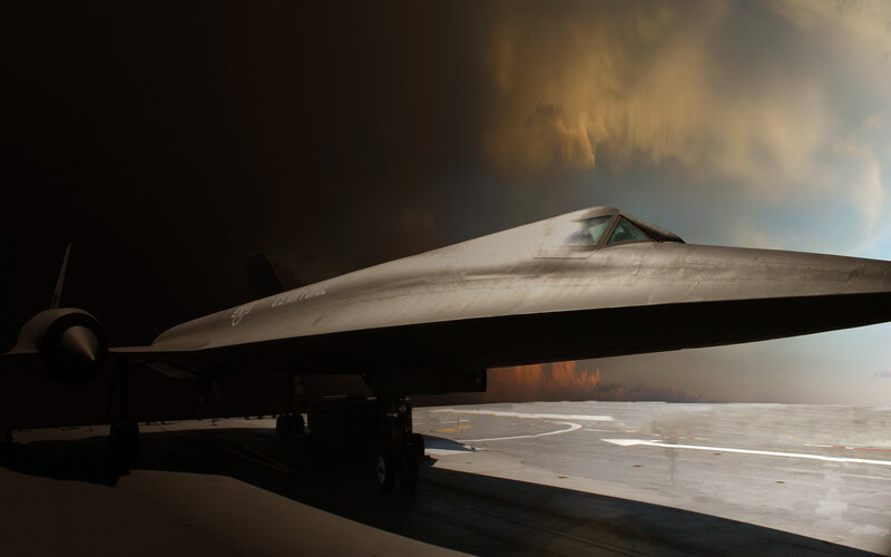 Black aircraft on runway at dusk