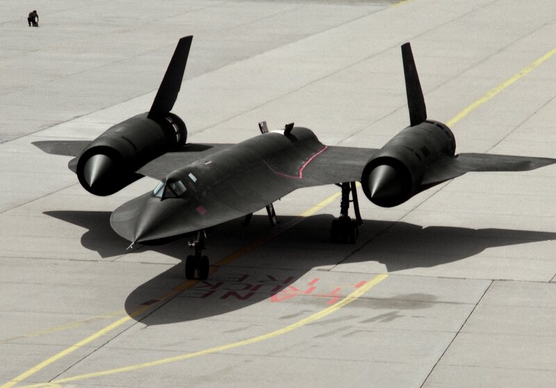 Black aircraft on tarmac