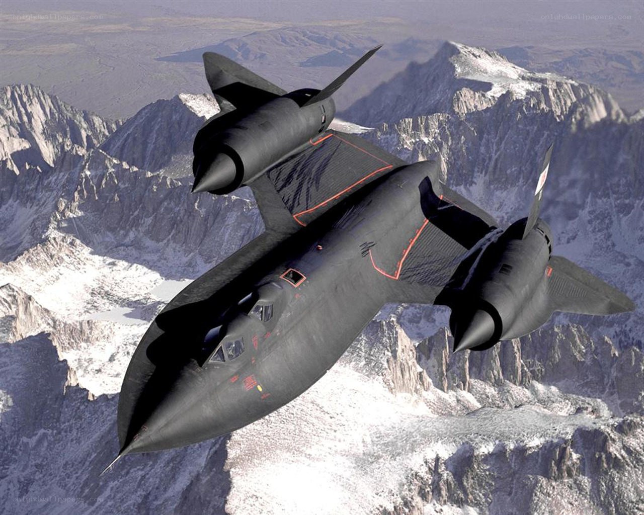 Black aircraft over mountains