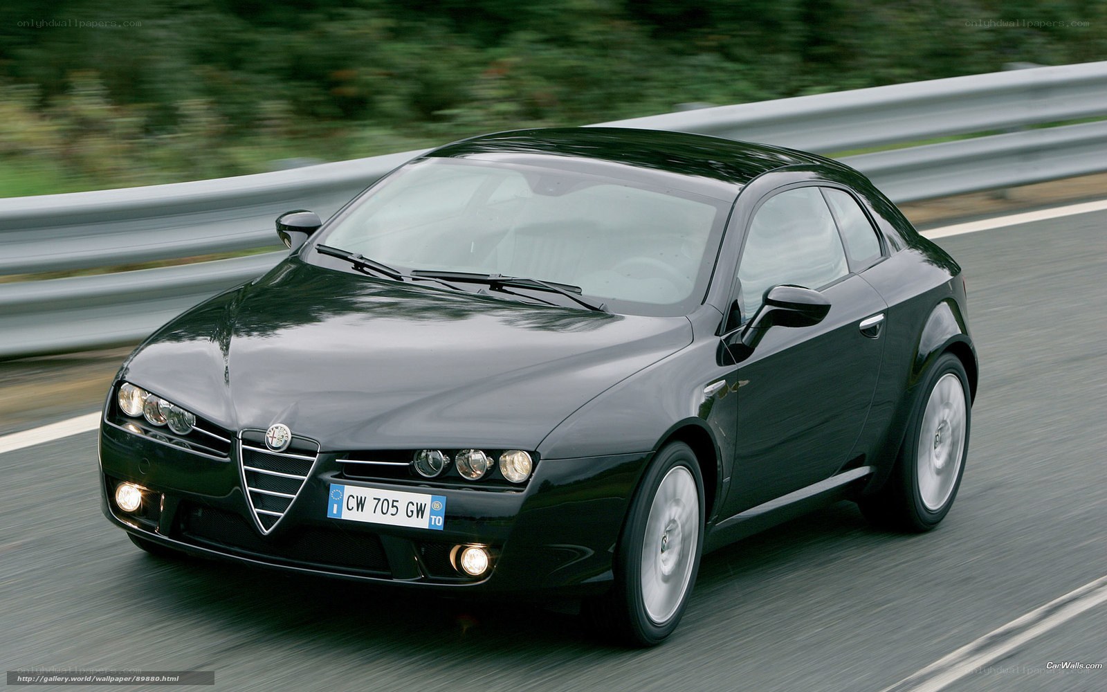 black alfa romeo driving on road