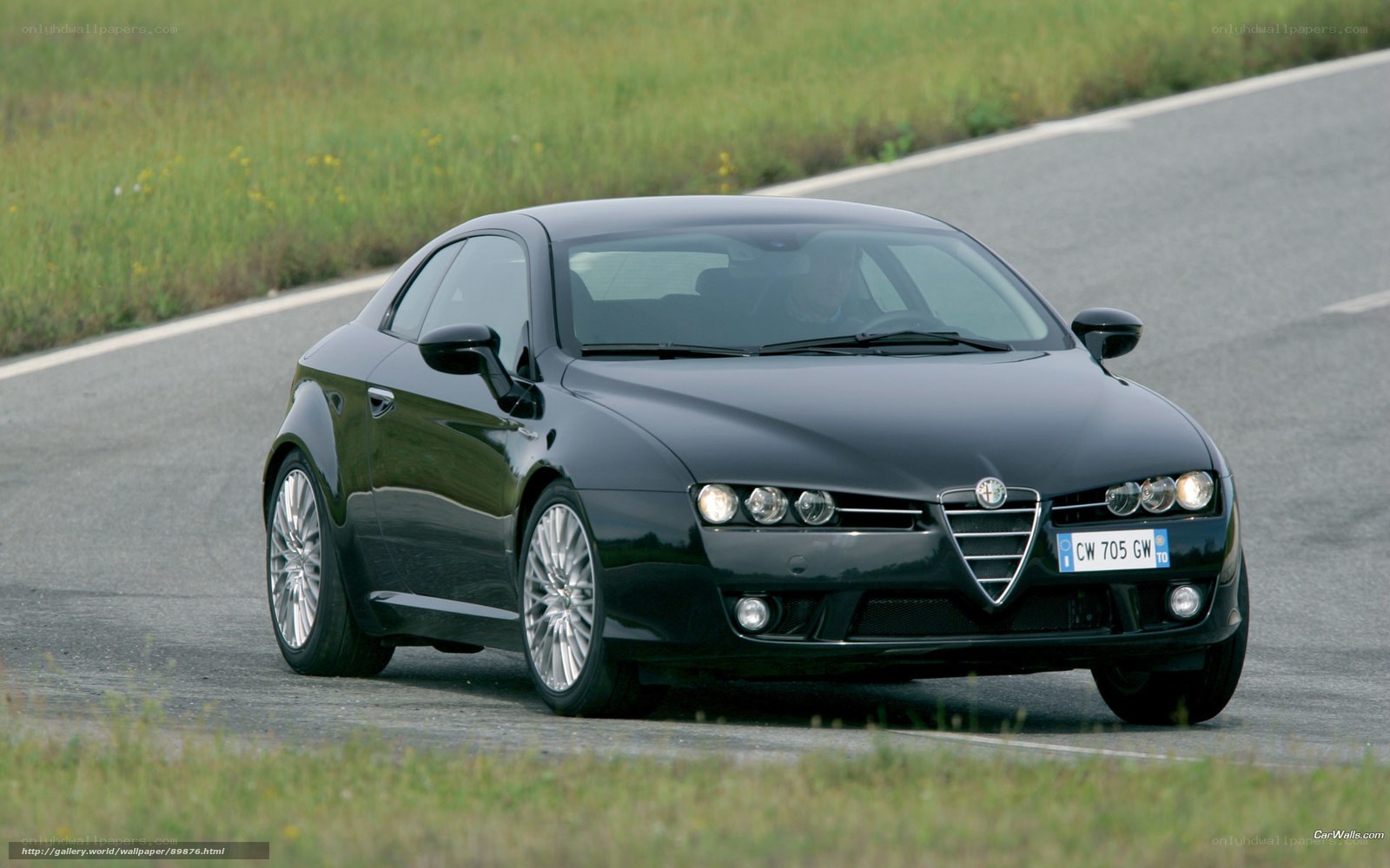 black alfa romeo driving on road