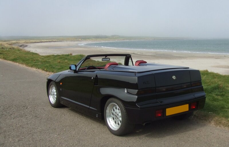Black Alfa Romeo RZ by the beach