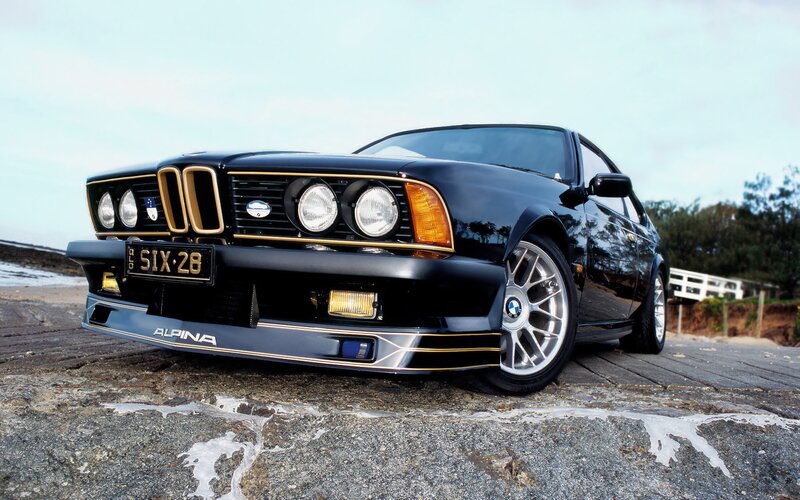 Black Alpina BMW on the beach