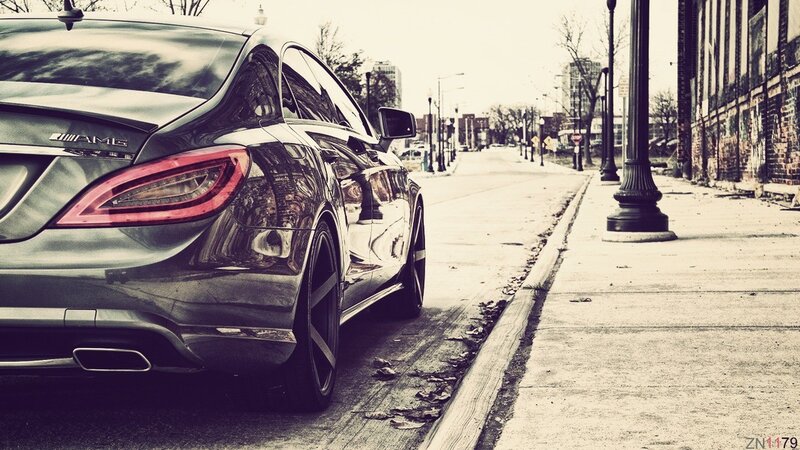 Black AMG car on city street