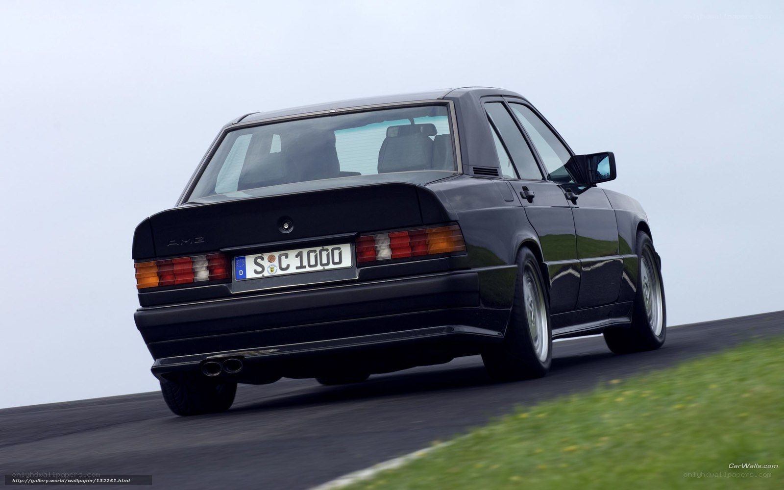 black amg sedan on track