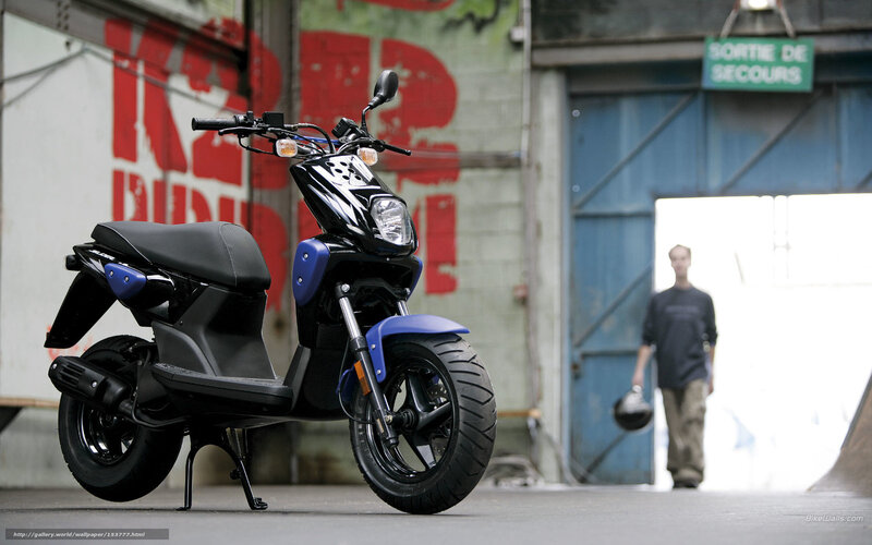 Black and blue scooter in warehouse