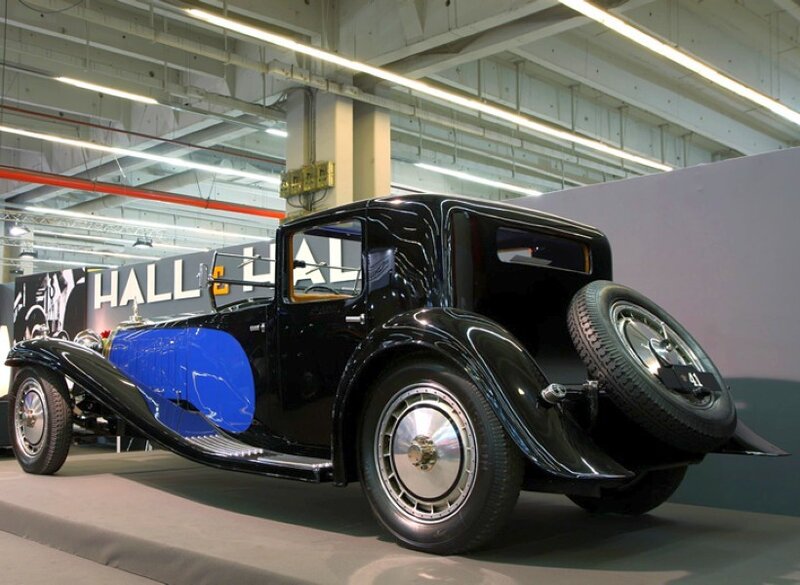 Black and blue vintage car on display