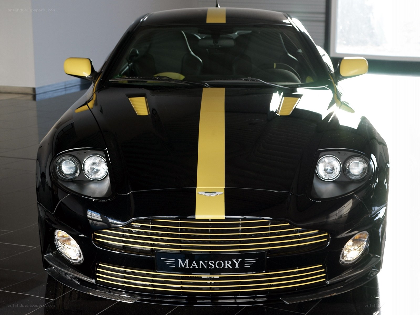 Black and gold Aston Martin