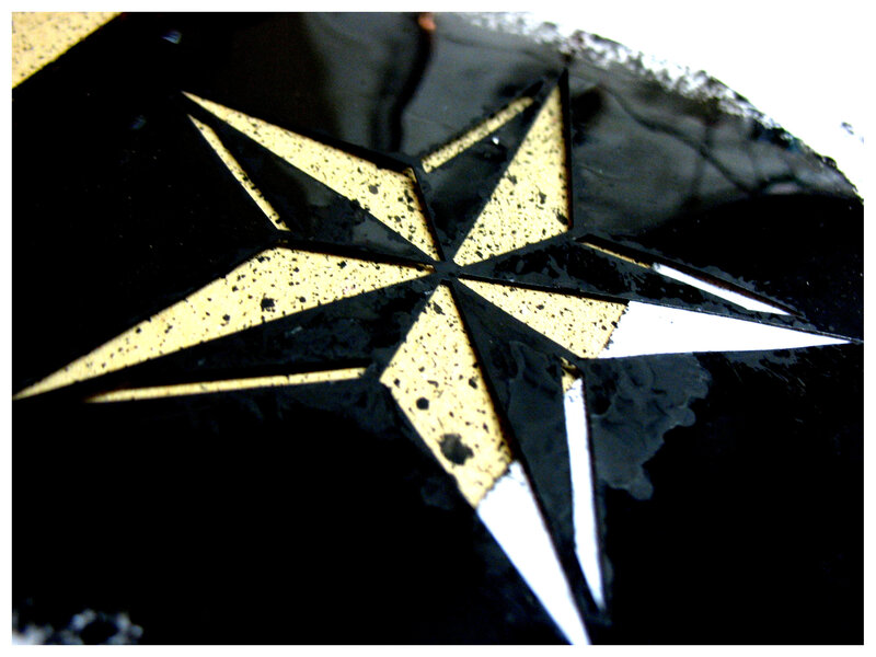 black and gold compass rose