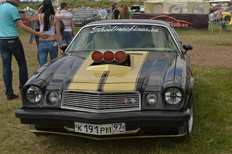 Black and gold muscle car at show