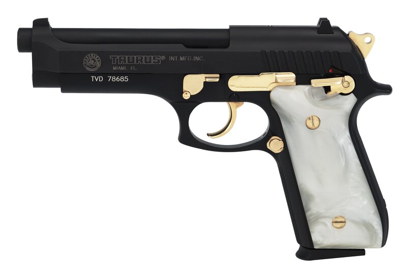 Black and gold pistol with pearl grips