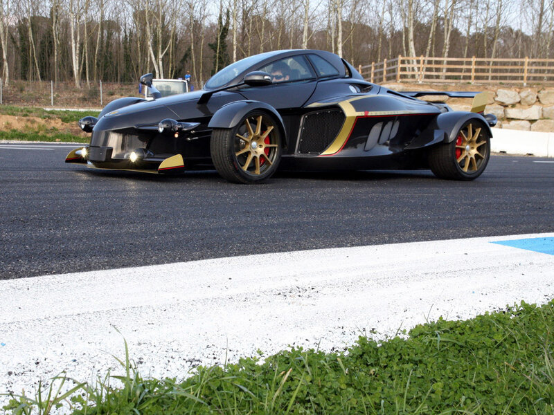 Black and gold race car on track