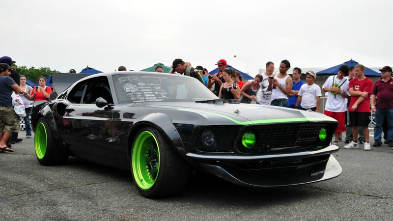 Black and green custom car on display