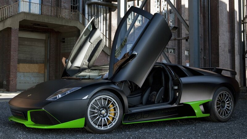 Black and green Lamborghini with doors open