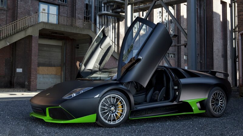 Black and green Lamborghini with doors open