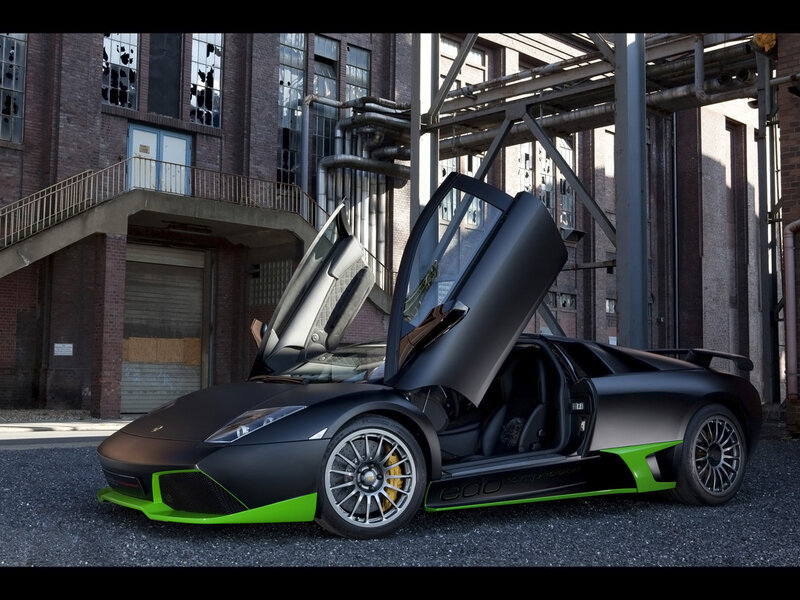Black and green Lamborghini with doors open