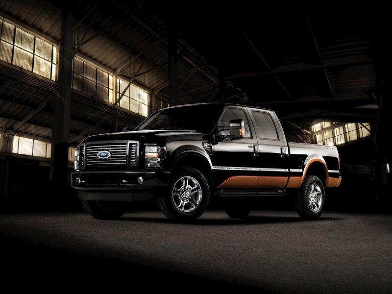 Black and orange Ford pickup truck
