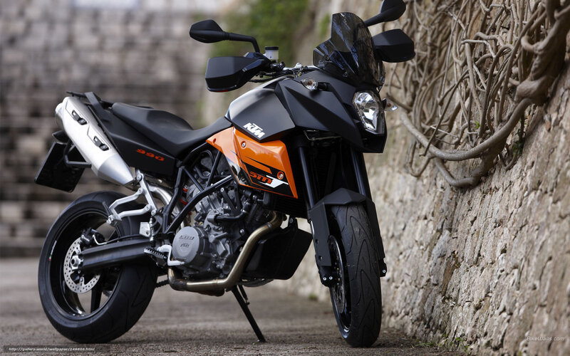 Black and Orange Motorcycle — Calm, Afternoon, Photograph, Stone Wall