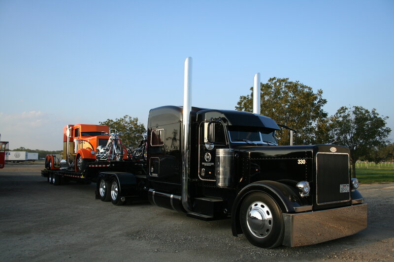 Black and orange semi-trucks