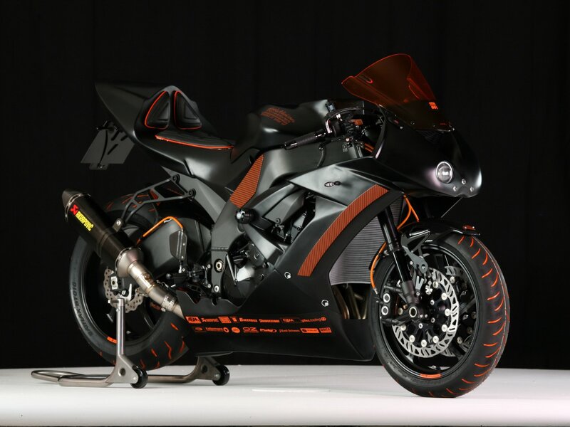 black and orange sport motorcycle