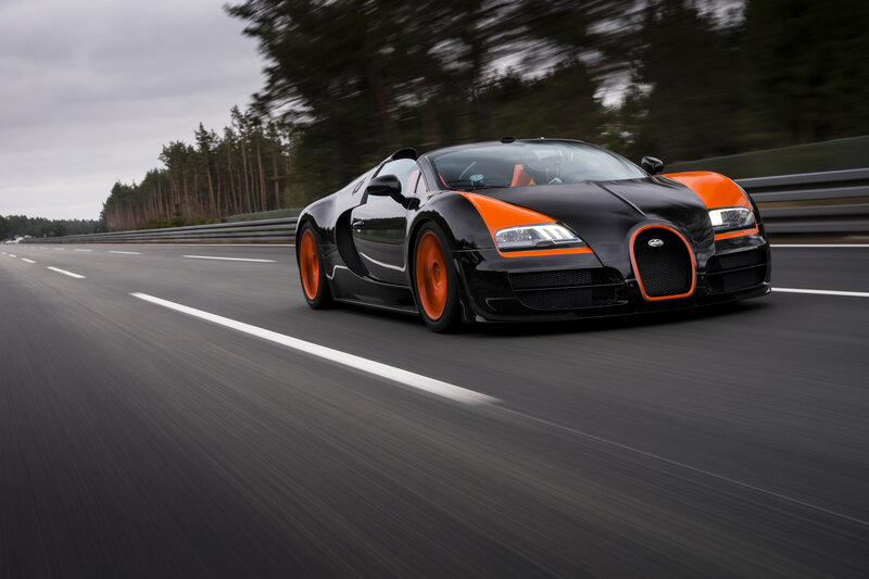 Black and Orange Sports Car — Dynamic, Photograph, Race Track
