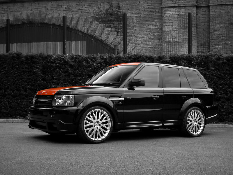 Black and Orange SUV — Dramatic, Photograph, Hedge, Brick Wall
