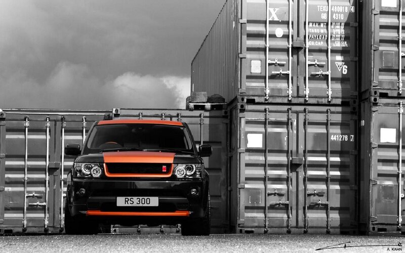 Black and Orange SUV — Dramatic, Photograph, Shipping Containers