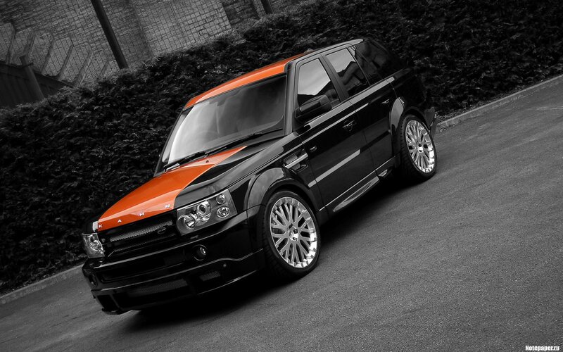 black and orange SUV on street