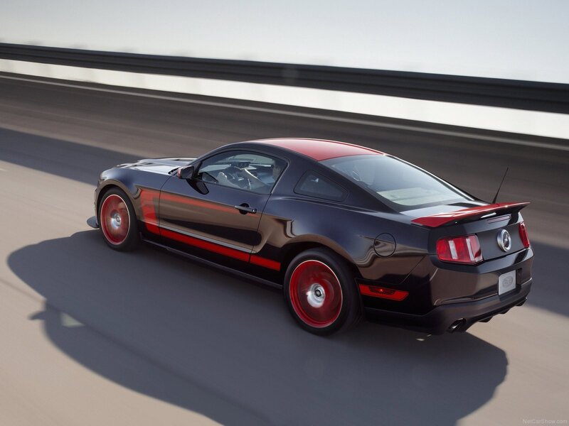 Black and red Ford Mustang on a highway