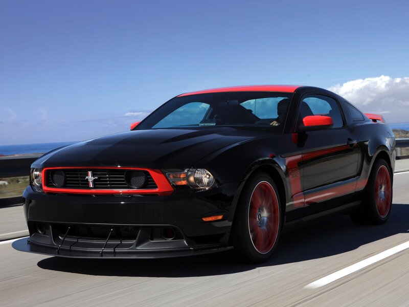 Black and red Ford Mustang on road