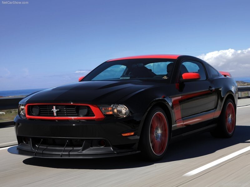 Black and red Ford Mustang on road