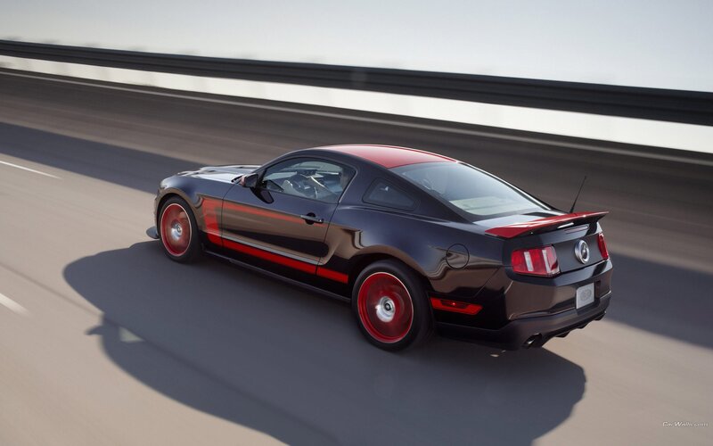 black and red mustang on highway