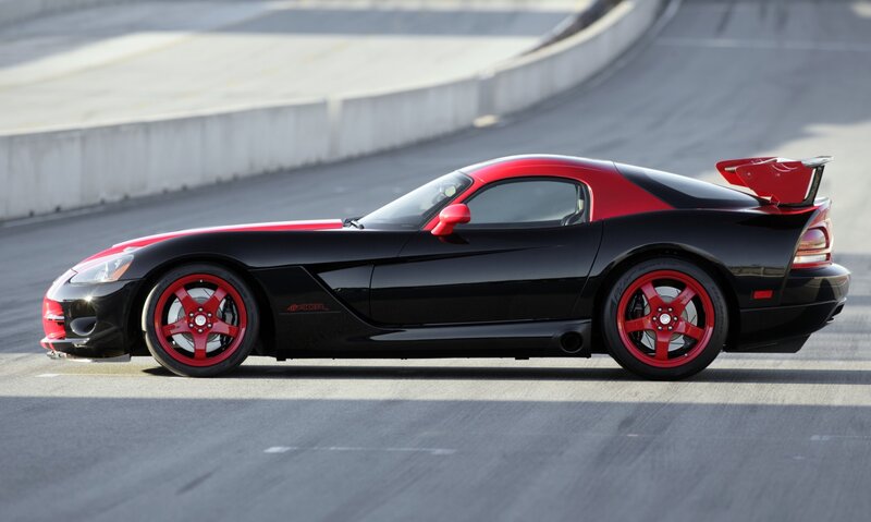 Black and red sports car on track