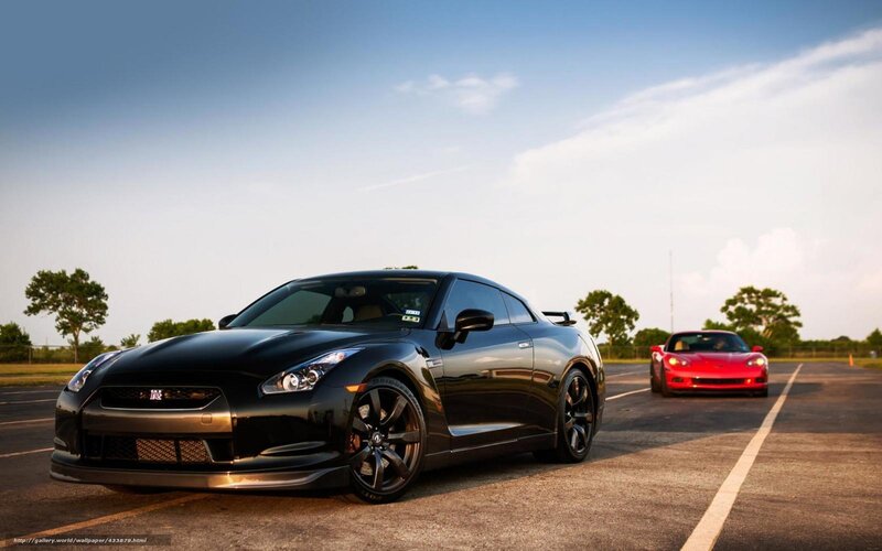Black and red sports cars on track