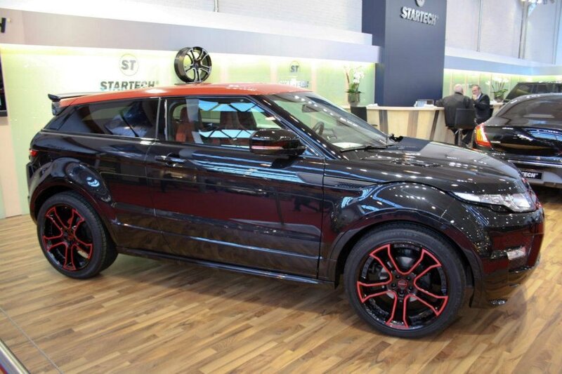 Black and Red SUV — Neutral, Photograph, Car, Showroom, People