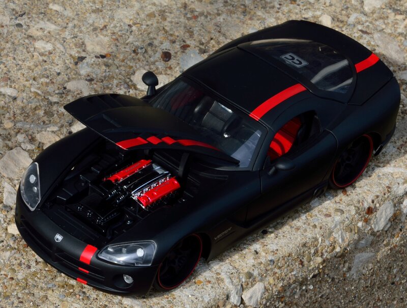Black and Red Toy Car — Dramatic